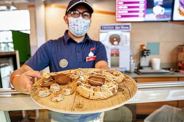 Employee serving cookies
