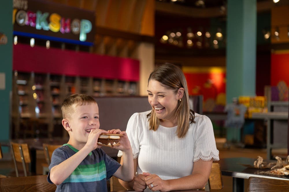 Mom and son with s'more
