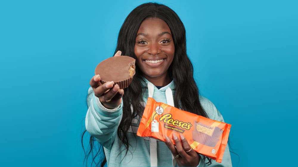 Girl holding World's Largest REESE'S Cup