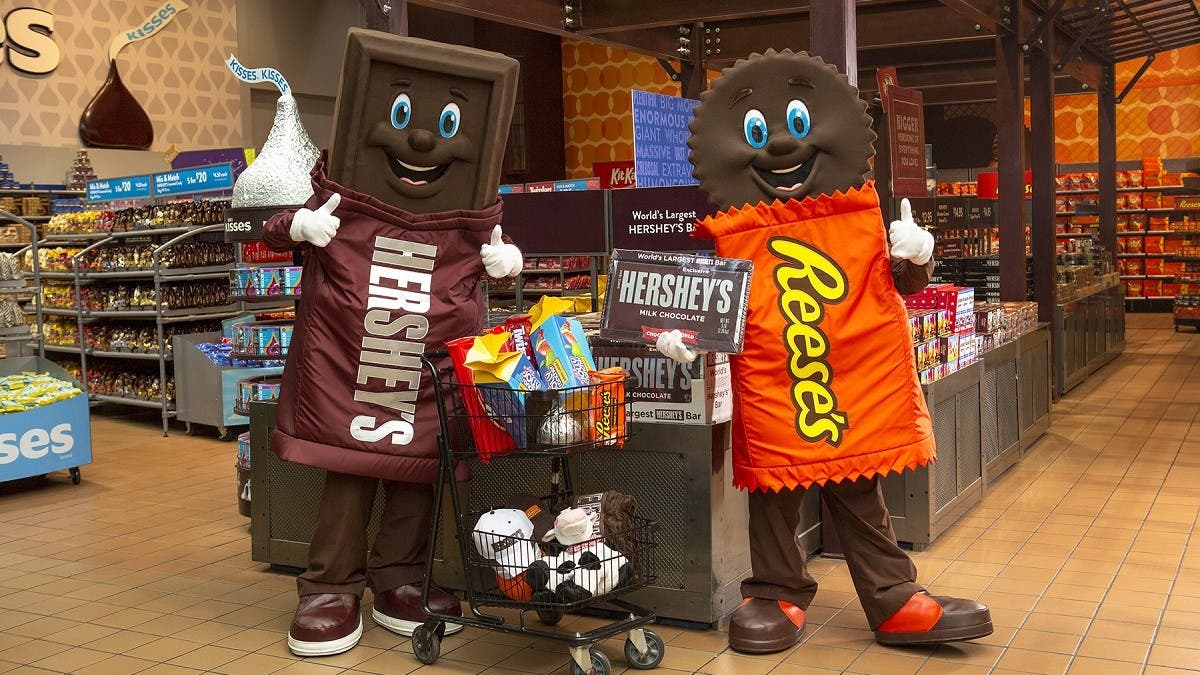 Child holding giant Hershey's Chocolate Bar