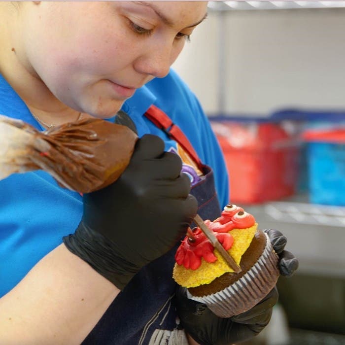Employee Decorating Cupcake