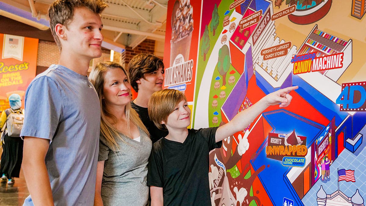 Family at attraction mural