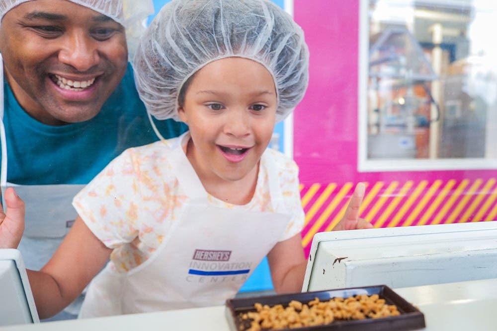 Child looking at assembly line