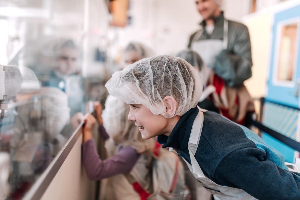 Child looking at assembly line